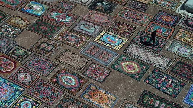 The plot where patterned and colored carpets are left to dry. 