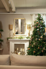Christmas tree and fireplace modern trendy style decor. Mantelpiece decoration on holiday season. Interior room decorated for  Xmas.