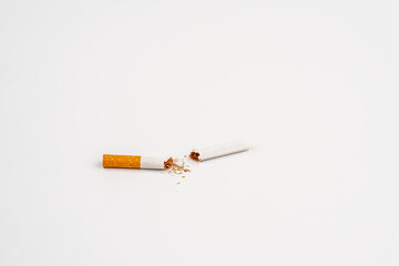 Broken cigarette isolated over the white background