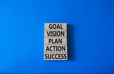 Goal Vision Plan Action Success symbol. Concept words Goal Vision Plan Action Success on wooden blocks. Beautiful blue background. Business and Goal Vision Plan Action Success concept. Copy space.