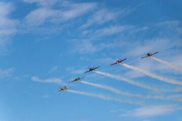 Stunt airplanes maneuver at airshow