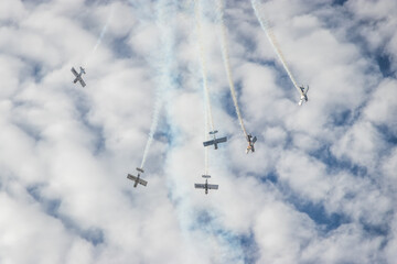 Stunt airplanes maneuver at airshow