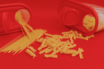 Red jar with macaroni on red background, monochrome