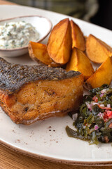 Fish flounder fried with vegetables and sauce