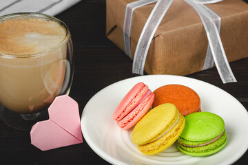 French macaroons on a white plate. Colored macarons.