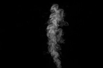 White curly smoke steam rising up is isolated on a black background to overlay on your photos. Smoky background