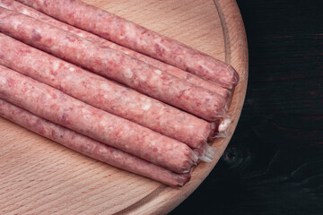 Homemade sausages. Sausages in natural casing. Raw BBQ sausages
