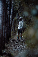 Fototapeta premium Post Apocalyptic environmental portrait with a gas mask in a dark forest in the evening