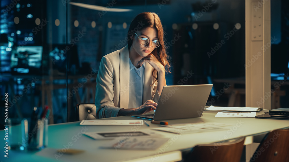 Poster Stylish Female Working on Laptop Computer in a Company Office in the Evening. Young Project Manager Browsing Internet, Writing Tasks, Developing a Marketing Strategy for a Financial Institution.