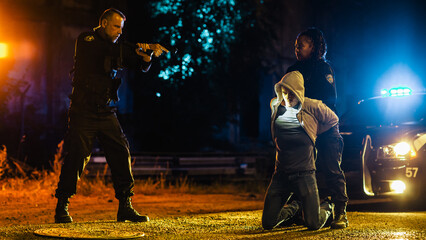 Black Female Police Officers Handcuffing a Compliant Suspect While her Male Partner Intimidats and...
