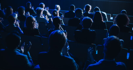 Crowd of Smart Tech People Applauding in Dark Conference Hall During a Motivational Keynote...
