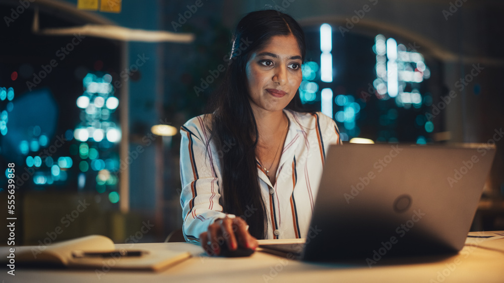 Poster indian female working in creative agency in the evening, implementing modern business strategy for c