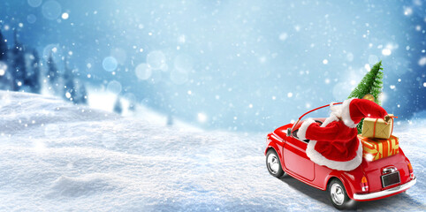 Santa Claus in Red car delivering christmas tree and presents at snowy background. Christmas card