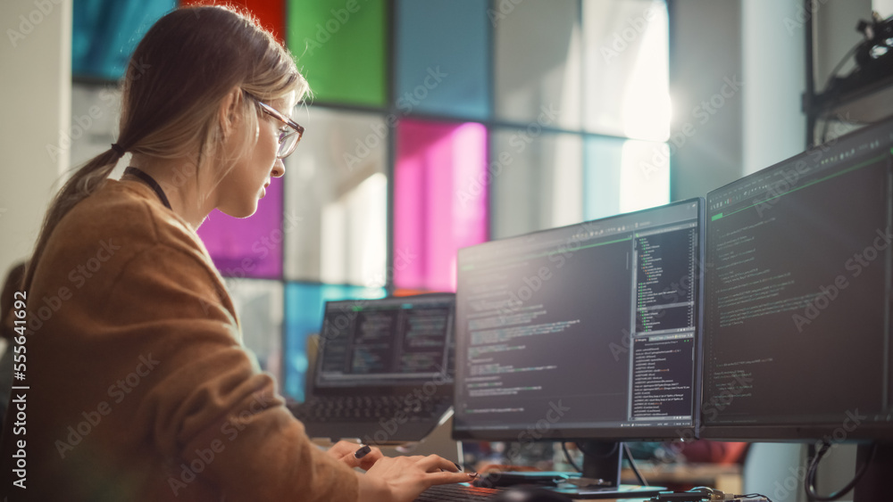 Poster Female Software Engineer Writing Lines of Code on Professional Multiple Display PC Setup In Stylish Office. Caucasian Woman Fixing Bugs and Creating New Features For Innovative Digital Service.