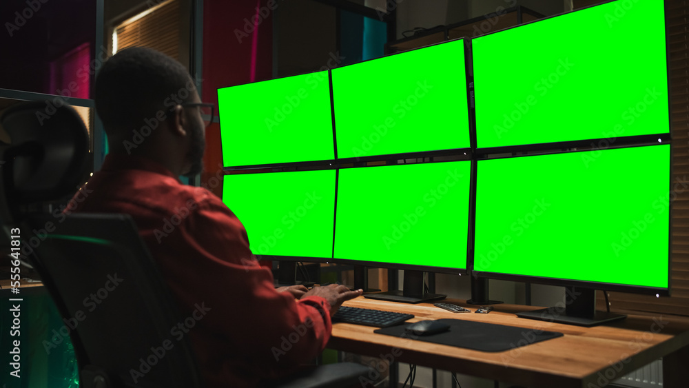 Poster Black Cyber Security Specialist Coding on Desktop Computer With Six Monitors With Green Screen Chromakey. African American Male Contractor Monitoring Data Protection System For Private Sector.