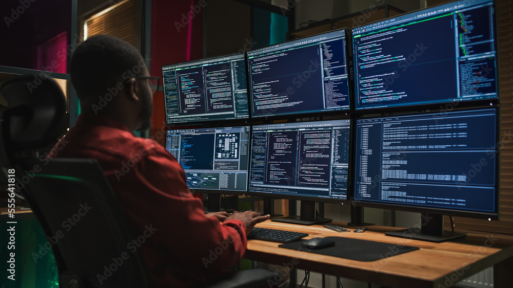 Aufkleber black cyber security specialist coding on desktop computer with six monitors in dark office. african