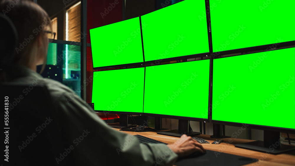 Fototapete Female Cyber Security Student Coding on Desktop PC With Six Monitors Setup With Green Screen Chromakey. Caucasian Woman Finishes Internship for Big IT Company. Monitoring System, SAAS Server Data.