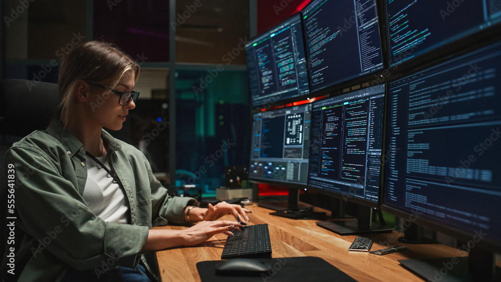 Poster Female Programmer Coding on Desktop Computer With Six Monitors Setup in Dark Office. Smart Caucasian Woman Monitors Data Protection System For Cyber Security Department IT Company