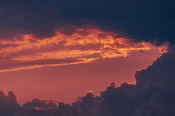 Pink sky hole in the stormy clouds