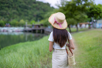 Woman go the countryside with the lake view