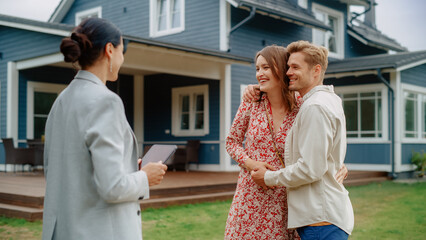 Successful Couple Striking Deal with Realtor in Front of Their New Home. Real Estate Agent Congratulating Young Homeowners with Property Purchase.