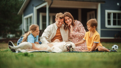Portrait of a Happy Young Family Couple with a Son and Daughter, and a Noble White Golden Retriever...