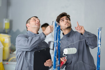 young man using a painting roller
