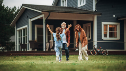 Grandfather and Grandmother are Happy to Meet Their Granddaughter in Front of their Suburbs House....