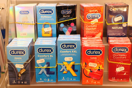 Various types of Durex condoms on sale in an Italian pharmacy.