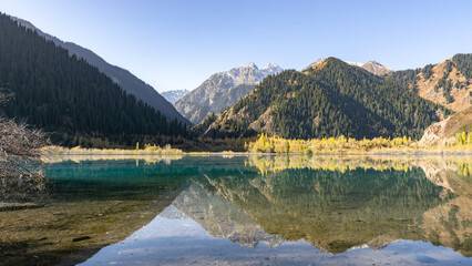 golden autumn in a mountain gorge. beautiful mountain lake