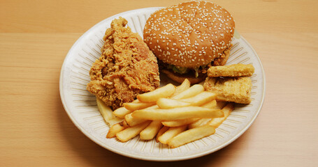 Junk food with french fires, burger and chicken fries