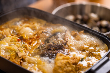 Homemade fish head soup hot pot