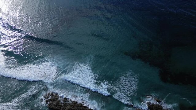 Overhead View Of Ocean Waves During Sunset At Playa de Caion In Galicia, Spain. Aerial Shot