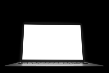 modern laptop computer on the tabl on the black blackboard background