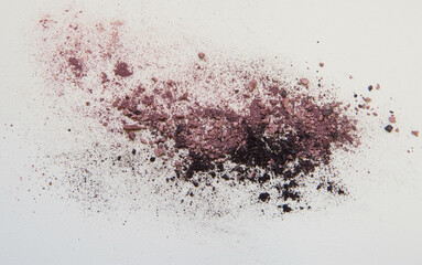 Crushed viomet and black eyeshadows isolated on white background