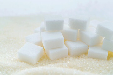 Sugar cubes on top of granulated sugar