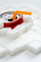 Cola can in pile of sugar cubes