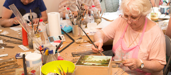 Women in an art workshop making decoupage boxes - obrazy, fototapety, plakaty