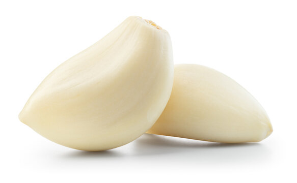 Garlic clove isolated. Garlic cloves on white background. Peeled white garlic cloves with clipping path. Full depth of field.