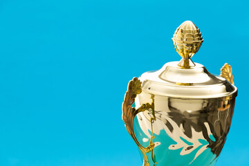 Golden trophy cup with a lid