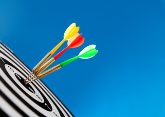 Three darts hitting on center target