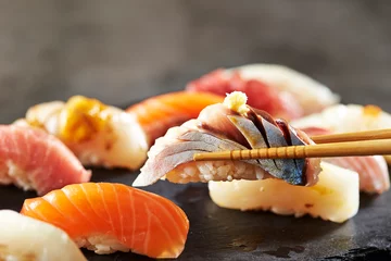 Foto op Canvas Horse mackerel sushi on chopsticks © mnimage