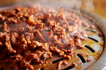 Stir-fried spicy meat on iron plate