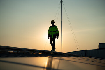 Technicians provide quarterly solar cell maintenance services on the factory roof - Powered by Adobe