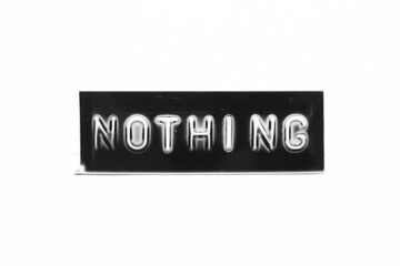 Black color banner that have embossed letter with word nothing on white paper background