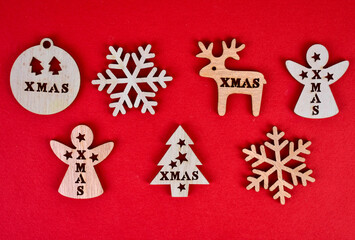 Christmas wooden toys on a red background.
