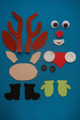 Christmas New Year Santa's deer handmade. Step by step photo instruction. DIY concept. Step 2-13. Preparation elements. Cut, draw - eyes, nose, antlers, mittens, boots, scarf. Top view, Flat lay
