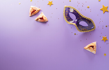 Happy Purim carnival decoration concept made from mask and sparkle star and hamantaschen cookies on pastel background. (Happy Purim in Hebrew, jewish holiday celebrate)