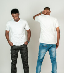 Two african man with white blank shirt doing a simple pose on the white background