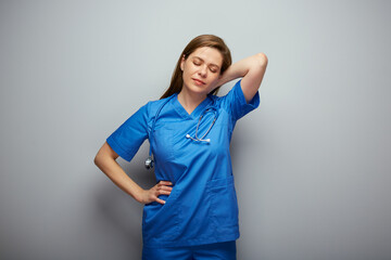 Tired doctor woman or nurse standing with hand on neck, closed eyes. Isolated portrait of female...